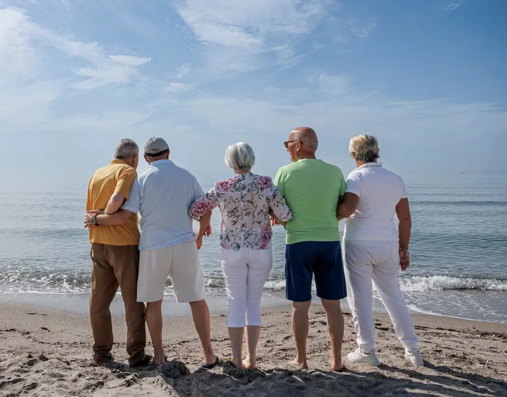 group of senior friends enjoying beach medicare retirement and insurance services of florida brandon fl