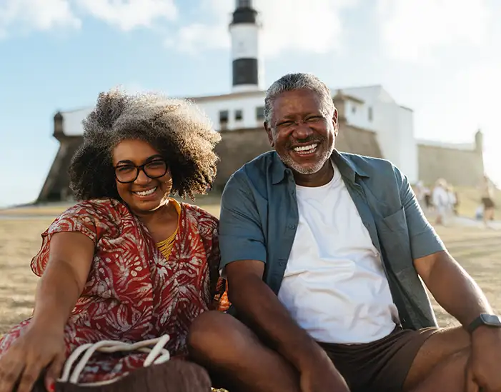 joyful grandparents sitting at beach health insurance retirement and insurance services of florida brandon fl